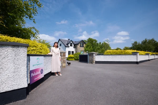 Photo of Fiona in front of house